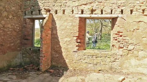 Looking through a window in an old building people in background Stock Footage 37633350