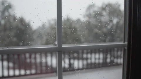 Looking Through the Window as Snow Falls from the Sky Stock Footage 229223118