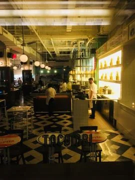 Looking through the window into Tacombi bar and restaurant on a slow night. W Stock Photos