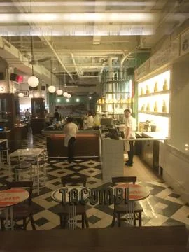 Looking through the window into Tacombi bar and restaurant on a slow night. W Stock Photos
