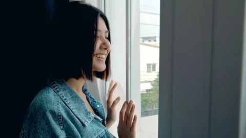 Looking through window waiting for boyfriend Stock Footage 265862508