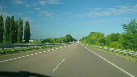 Looking through windshield up in blue sky at summer sunny day. Wide angle view Stock Footage 184551067