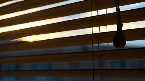 Looking Through the Wood Window Blinds. Sunlight through blinds Видео 61190769