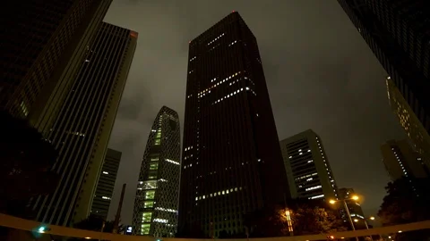 Looking Up the Tokyo Skyline at Night Stock Footage 92998657