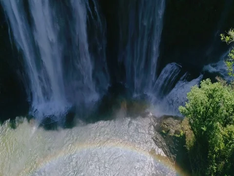Looking up Towards Waterfall with Rainbow Below Stock Footage 79155725