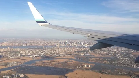 Looking trough window of an aircraft, airplane or plane wing. View from plane Stock Footage