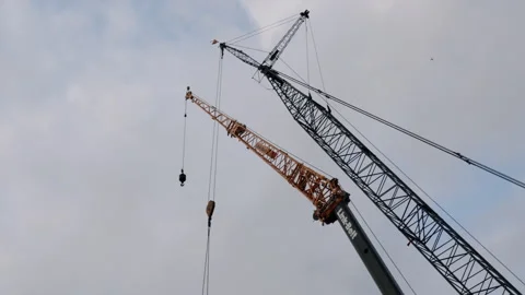 Looking Up At Two Construction Site Cranes 4K 48FPS SLO-MO Stock Footage 265701330