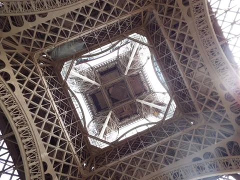 Looking up underneath the Eiffel tower in Paris Stock-Fotos