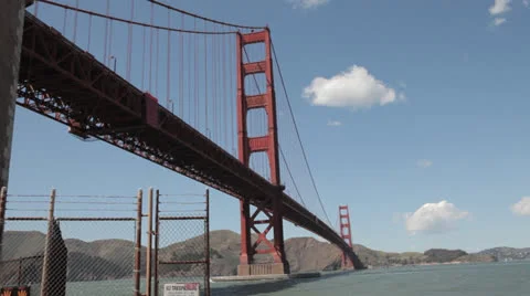 Looking up at the underside of Golden Gate Bride on a sunny windy day Stock Footage 22663005