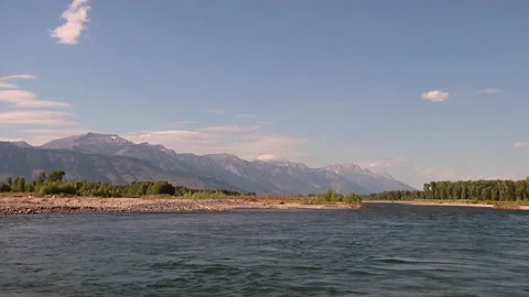 Looking Upstream to Mountains While Floating on River Stock Footage 197999512