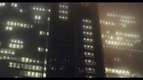 Looking upwards at corporate skyscraper with moving elevators Stock Footage 142512434