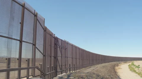 Looking at the US and Mexico Border Fence from Side to Side Stock Footage 60406941