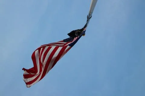 Looking up at a US flag Stock Photos