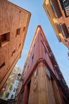 Looking up view of an old building with a sharp angle Stock Photos