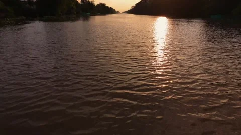 Looking at the Water Surface at Sunset Vídeos de archivo 343606648