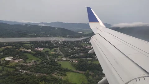 Looking At Wind Vortices Off End Of Airplane Wing As It Flies Through The Stock Footage 254388426