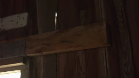 Looking at the window frame of the old barn / Sliding movement Stock Footage 130886285