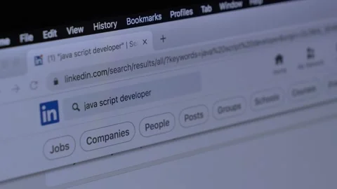 Looking for wok at LinkedIn as Java Script developer on laptop at home Stock Footage 166119700