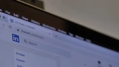 Looking for wok at LinkedIn as Java Script developer on laptop at home Stock Footage 166119713