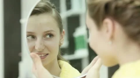 Looks at a mirror Stock Footage 12229536