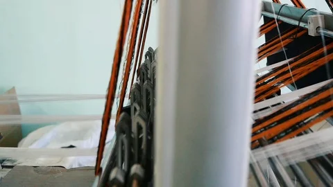 Loom creates fabric from needles and threads, slow shooting Stock Footage 103177330