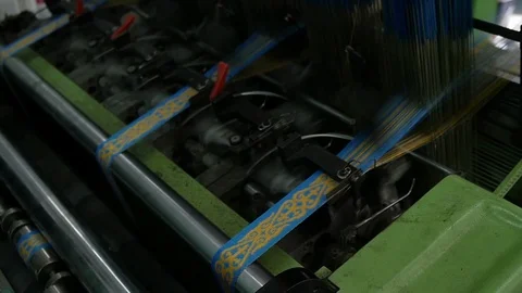 Loom creates fabric from needles and threads, slow shooting Stock Footage 103177889