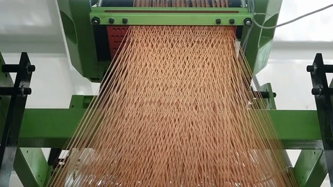 Loom creates fabric from needles and threads, slow shooting Stock Footage 103178237