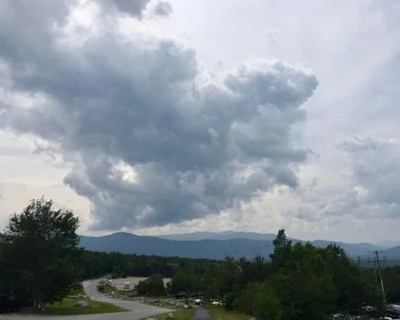 Looming Clouds Over Mountains Stock Photos