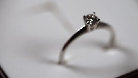 A looming focus on a diamond ring in an open box. Stock Footage 310227427