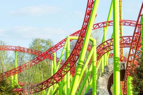 Loop and turn on a roller coaster in an amusement park. Stock Photos