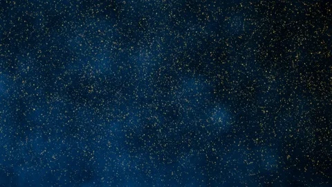 Loop animation of golden sparkles on dark backdrop. Stock Footage 87844409