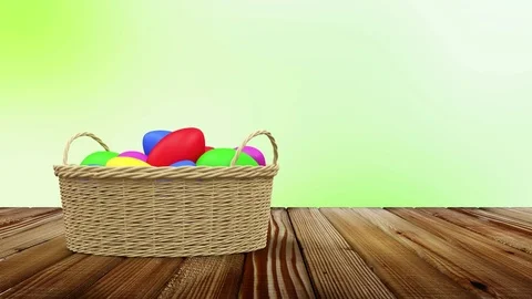 Loop Animation of Painted Easter Eggs on a Wicker Basket Stock Footage 73345887