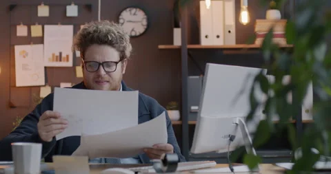 Loop of annoyed businessman reading documents then throwing papers away working 스톡 동영상 275521517