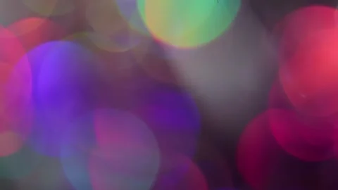 Loop background video overlay with large rainbow bokeh lights Video stock 318072391