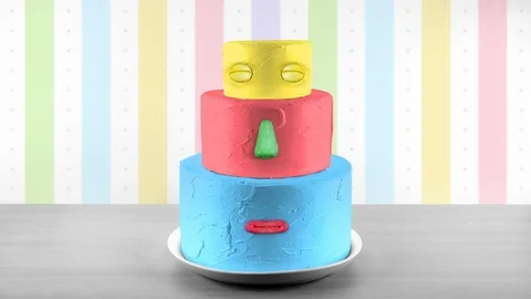 Loop of birthday cake being assembled one layer at a time Stockbeeldmateriaal 90915900