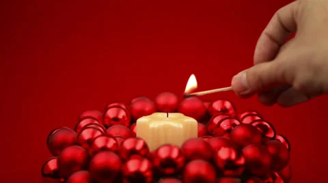 Loop of christmas candle getting lit and blown out Video stock 30582875
