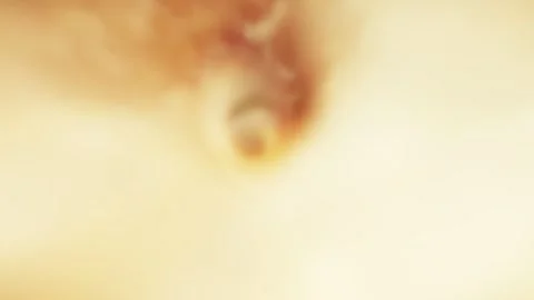 Loop cinematic flight through a deep red and golden cosmic nebula void Video stock 347590861