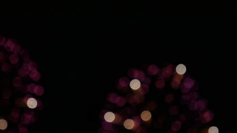 Loop close up of real blurry fireworks background with bokeh lights in the night Stock Footage 144681806