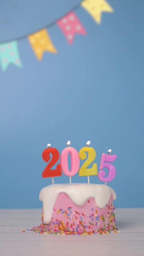 Loop of colorful candle number 2025 on cute cake for new year celebrate party Stock Footage 294023966