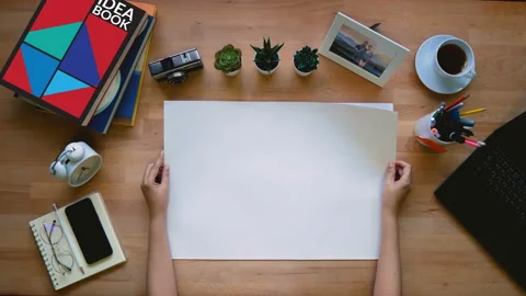 Loop of creative occupation hand flip on blank sketch paper stack on desk Stock Footage 131827407