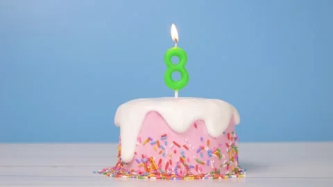 Loop of cute birthday cake with number eight candle to celebrate 8th birthday 動画素材 294521054