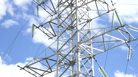Loop of of an electricity pylon shot from a low angle, Stock Footage 137259411
