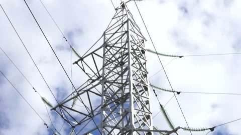 Loop of of an electricity pylon shot from a low angle, Stock Footage 137259446