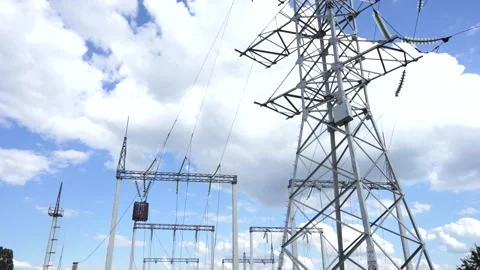 Loop of of an electricity pylon shot from a low angle, Stock Footage 137259522