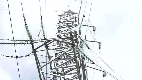 Loop of of an electricity pylon shot from a low angle, Stock Footage 137259614