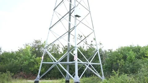Loop of of an electricity pylon shot from a low angle, Stock Footage 137259688