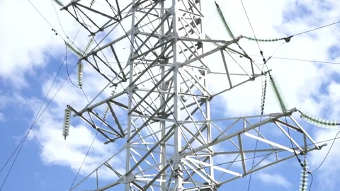 Loop of of an electricity pylon shot from a low angle, Stock Footage 137259810