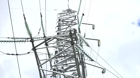 Loop of of an electricity pylon shot from a low angle, Stock Footage 137259973