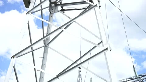 Loop of of an electricity pylon shot from a low angle, Video stock 137260061