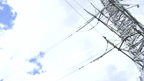 Loop of of an electricity pylon shot from a low angle, Video stock 137260107